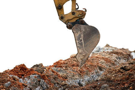 Mini excavator working in construction site isolated on white background