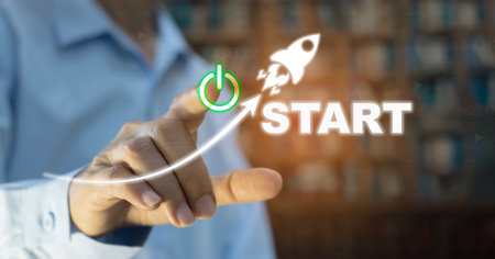 Hand of the businessman pressing power button. Start up business concept
