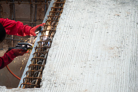 Welders are welding steel at a construction site.