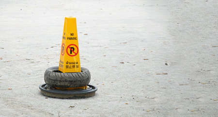 No Parking Traffic Cone Sign with display in 3 languages Thai, English and Chinese.の写真素材