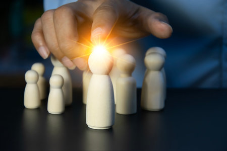 Wooden figures representing leadership and team
