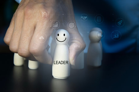 Wooden figures representing leadership and teamの写真素材