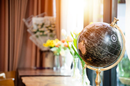 A relaxing corner by the window with soft red lightの写真素材