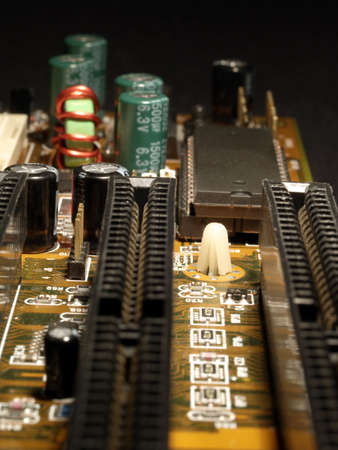 Close up of circuit board showing various electronic components