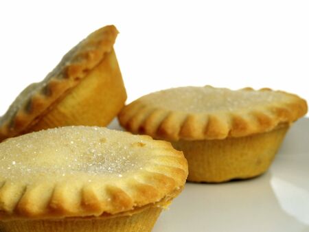Close up of three mince tarts on a plate. white backgroundの写真素材