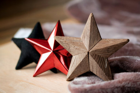 Christmas star decoration on wooden background. Christmas and New Year concept.の写真素材