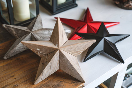 Christmas star decoration on wooden table in living room, vintage style.の写真素材