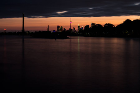 Toronto cityscape at sunset with reflection in lake Ontarioの写真素材
