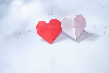 Two hearts made of Japanese origami. Love, peace, and marriage images.