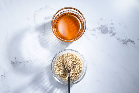 Dripping sesame oil. Edible and Beauty Oils.の写真素材