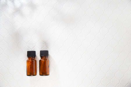 Aroma, two bottles of aromatic oil. Relaxation, beauty image.