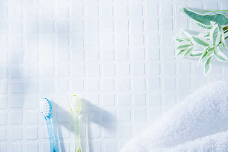 Two toothbrushes and a towel. Tooth care such as brushing teeth, image of daily life.の写真素材