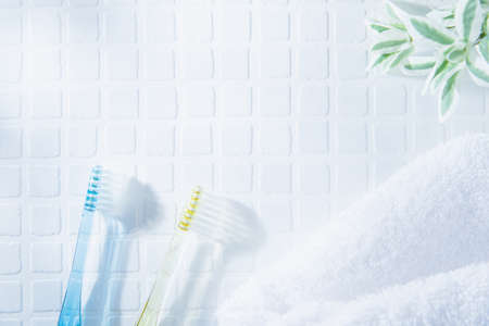 Two toothbrushes and a towel. Tooth care such as brushing teeth, image of daily life.の写真素材
