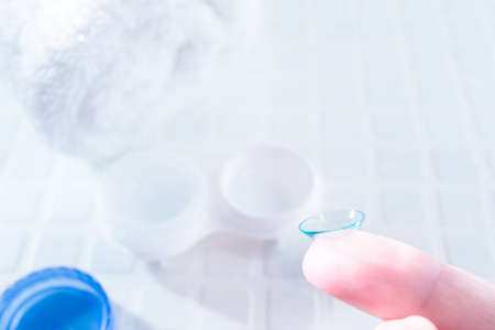 Wearing vision cornerion/contact lens to the eye. Glass and Replace. Cleaning of Contact Lensesの写真素材
