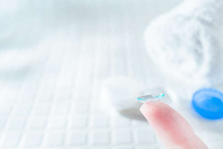 Wearing vision cornerion/contact lens to the eye. Glass and Replace. Cleaning of Contact Lensesの写真素材