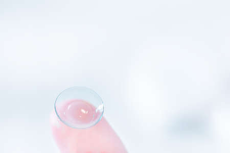 Wearing vision cornerion/contact lens to the eye. Glass and Replace. Cleaning of Contact Lensesの写真素材