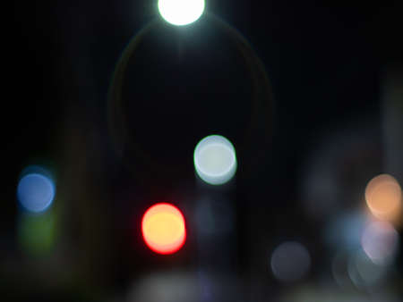 Night city light neon. Round bokeh of light in the night view. Black backgroundの写真素材