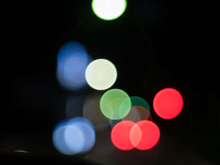 Night city light neon. Round bokeh of light in the night view. Black backgroundの写真素材