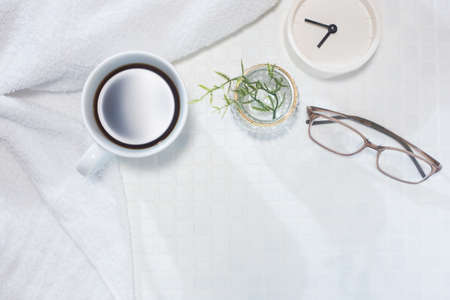Time to get ready in the morning, take a break, relax, glasses, coffee and a watch.の写真素材