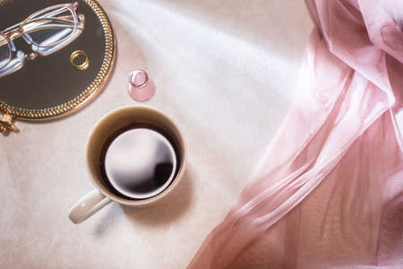 A mug with coffee and a woman's room image.の写真素材