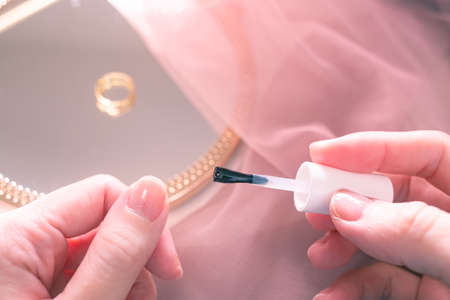 Apply clear nail polish. Do nail care.
