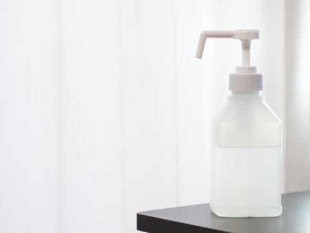 Disinfecting hands with alcohol disinfectant spray. Countermeasures against the new coronavirus, COVID-19.の写真素材