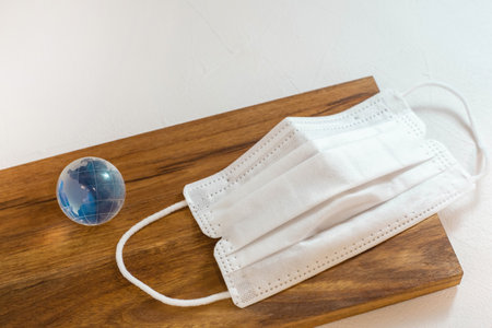Mask and globe of the Earth