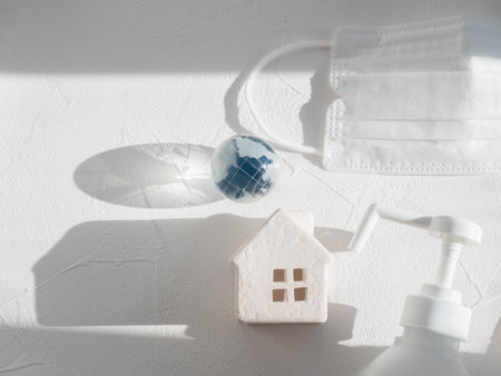 House, earth, disinfectant and mask. Image of preventive measuresの写真素材