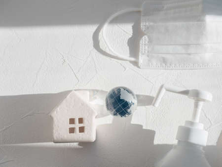 House, earth, disinfectant and mask.