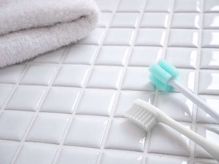 Brushing with a toothbrush. Tooth care and oral care. Toothbrushes and oral care sponge brushes.の写真素材