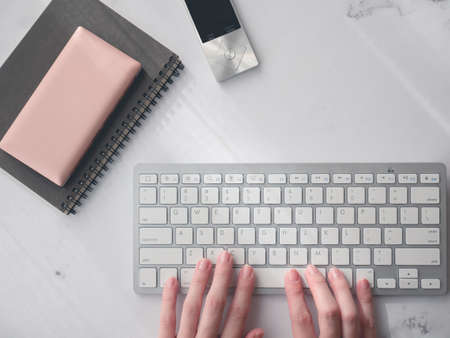 Remote work, work from home, telework. Lifestyle. Computer keyboard and notebook.の写真素材