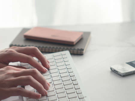 Remote work, work from home, telework. Lifestyle. Computer keyboard and notebook.の写真素材