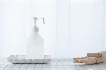 Disinfecting with Alcohol Disinfectant Spray. White background, disinfectant.の写真素材
