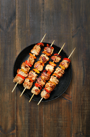 Barbecued chicken kebab in frying pan, top viewの写真素材