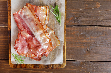 Fried bacon on paper. Top view, flat layの写真素材