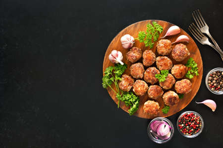 Fried meatballs on cutting board with copy space. Top view, flat layの写真素材