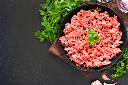 Raw beef minced meat on plate. Top view, flat layの写真素材