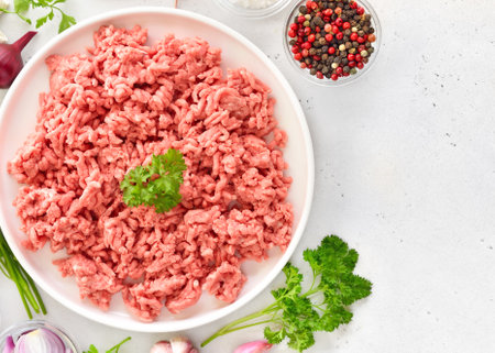 Raw beef minced meat over light background. Top view, flat layの写真素材