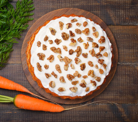 Carrot cake over wooden background. Top view, flat layの写真素材