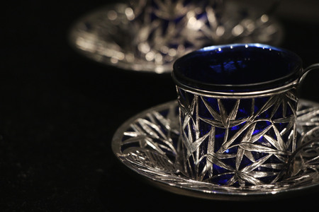 Silver cup and saucer on display in a museumのeditorial素材