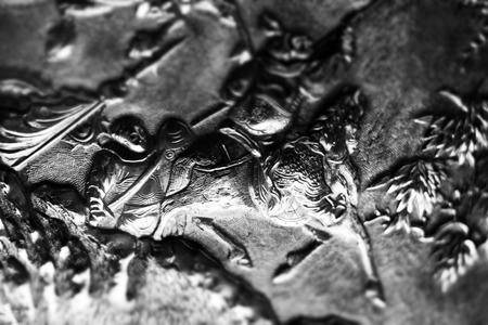 Close-up of details carved on a silverware in a museum