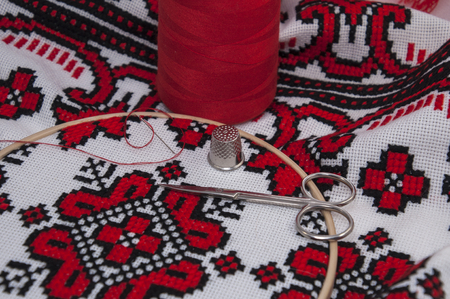 Embroidery on a white canvas with black thread, macroの写真素材