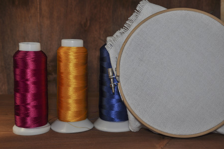 A set of subjects for an embroidery on a wooden table