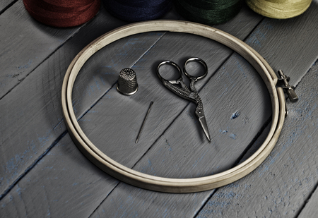 Items for needlework: sewing, hoop, scissors. The stylized images in dark colors.の写真素材