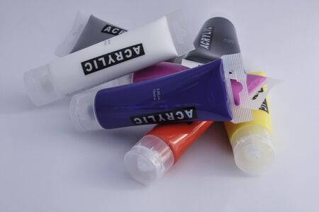 Colorful acrylic paints in tubes on a white backgroundの写真素材