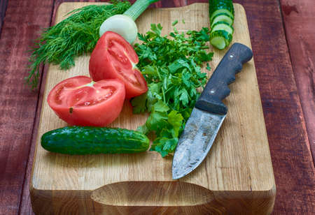 vegetables from the garden on the kitchen blackboard for saladsの写真素材