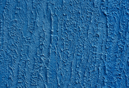 Detail of a blue bumpy cement wallの写真素材