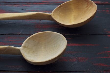 Two empty wooden spoon on vintage wooden table
