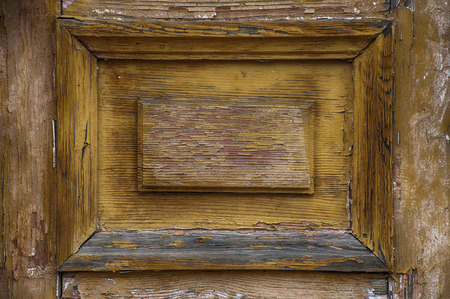 fragment of an old shabby yellow doors, horizontal compositionの写真素材