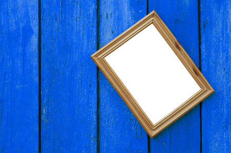 Wooden frame for photo on the blue wooden old background, horizontal compositionの写真素材